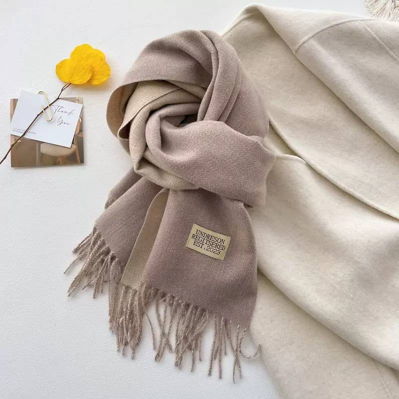 Label Accent Scarf With Cascading Folds And Tassels – Taupe