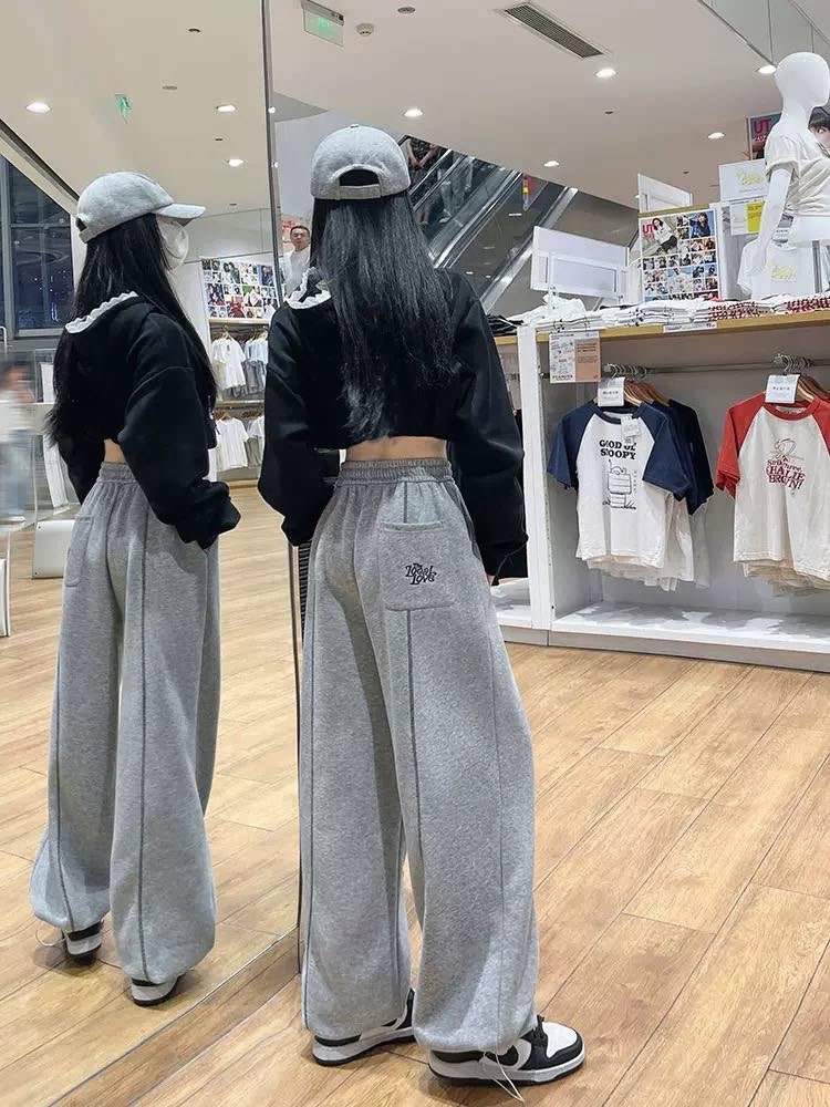Contrast-Stitched Pants With Wide Legs And A Lettered Pocket – Grey